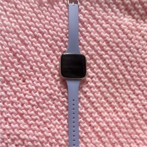 Smartwatch with Lavender Strap Fitbit and will come with charger